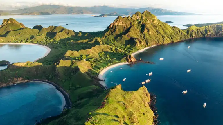 Panorama of the water and green hills surrounding the bays of Padar Island
