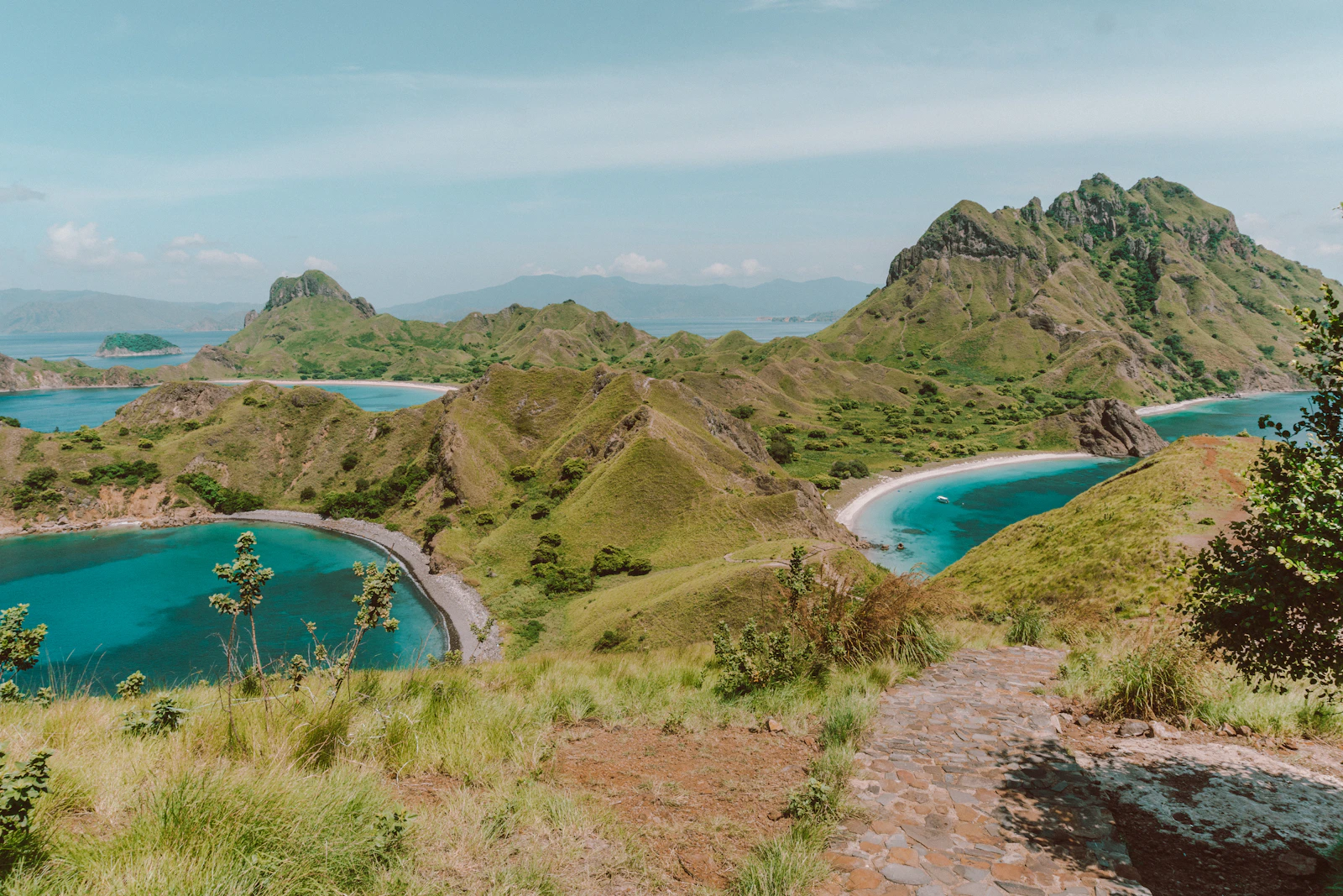 A calm-water bay near Padar Island's boat landing point where visitors swim