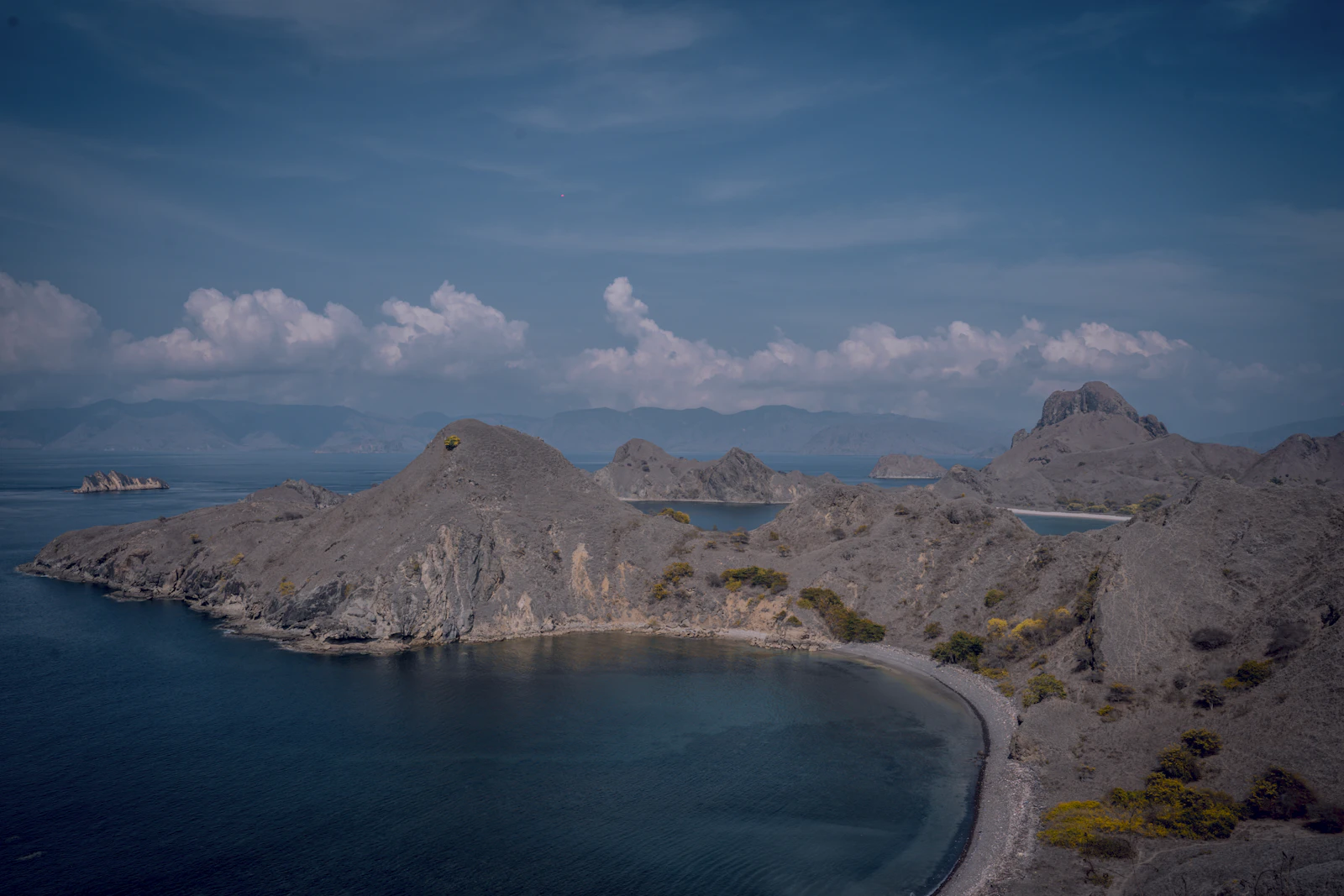 The hills of Padar Island surrounding the calm water of the bay