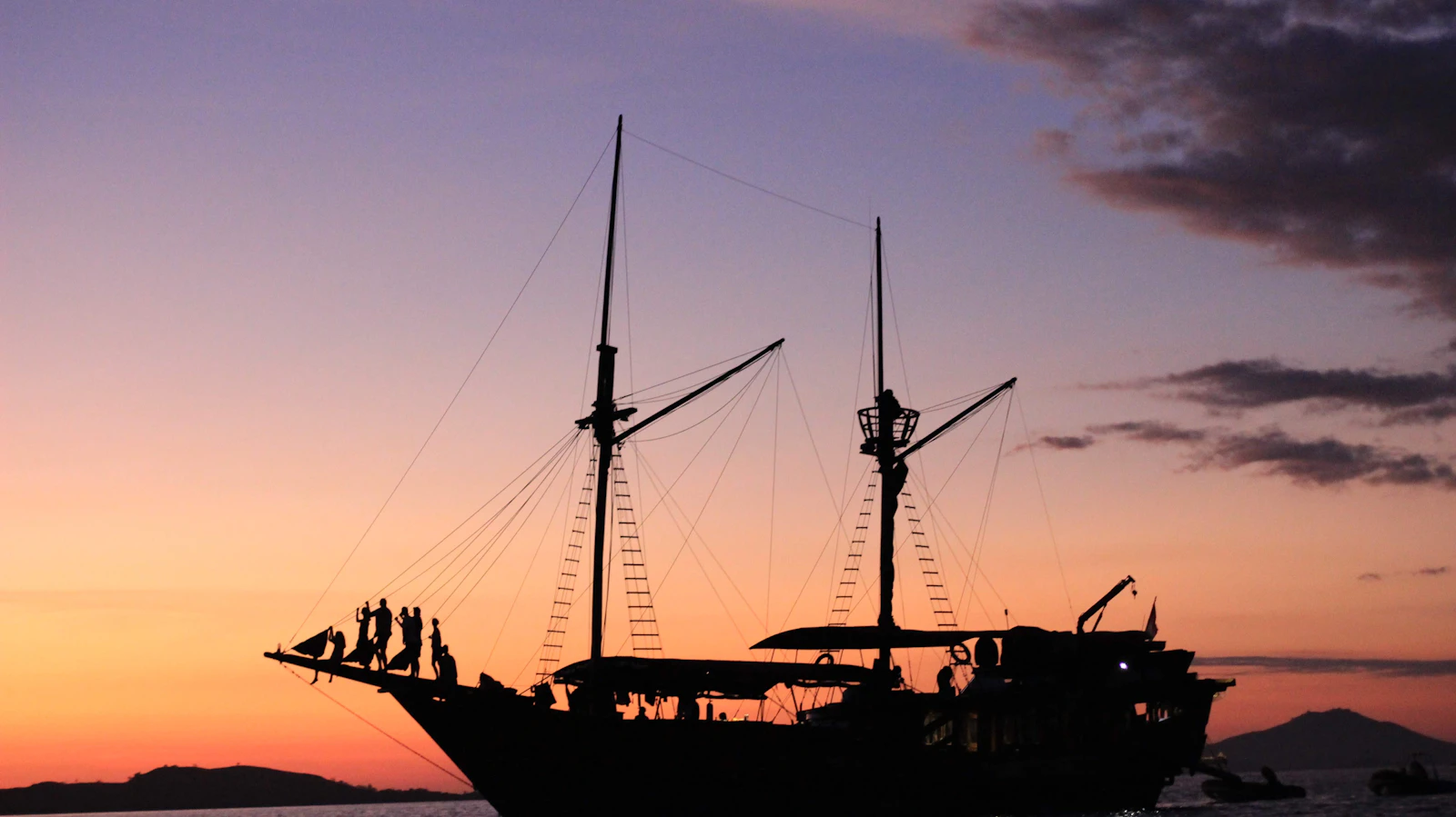 A phinisi boat enjoying the sunset near Kalong Island, in the Labuan Bajo area
