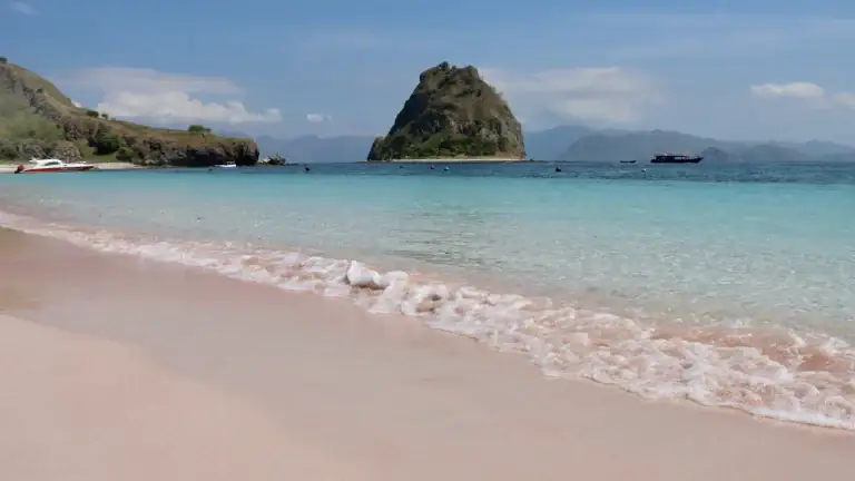 Pink Beach in Komodo National Park with clear water and reddish sand