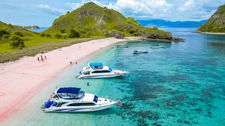 A group of tour boats moored near Pink Beach, Komodo Island